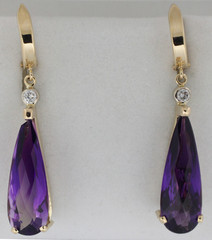Shown here is pair of amethyst and diamond drop-style earrings suitable for day or nightwear.