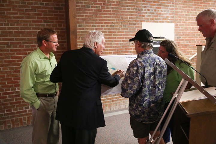 Attorney Mike Andreoli, second from left, explains plans for the Vonterra development after the parks board meeting. (Photo by Ann Marie Shambaugh)