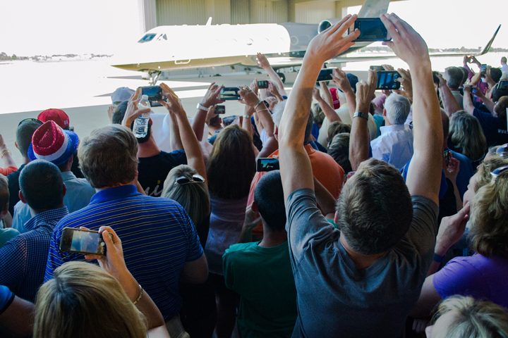 Members of the crowd take photos of Mike Pence’s airplane. Mike Pence delivered his speech as soon as he stepped off of his airplane.