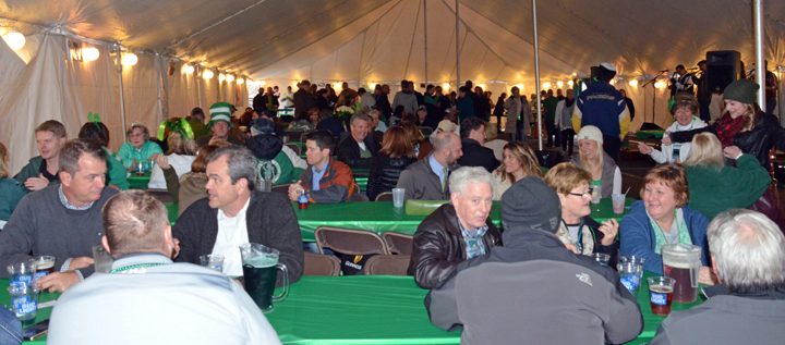The Friendly Tavern St Patrick's Day Tent Party kicked off at 5 p.m. March 17. By 6 p.m., the outdoor tent was full of patrons sipping beers, listening to the band, and noshing on corned beef and cabbage. The party went until 10 p.m. (Photo by Sara Baldwin)