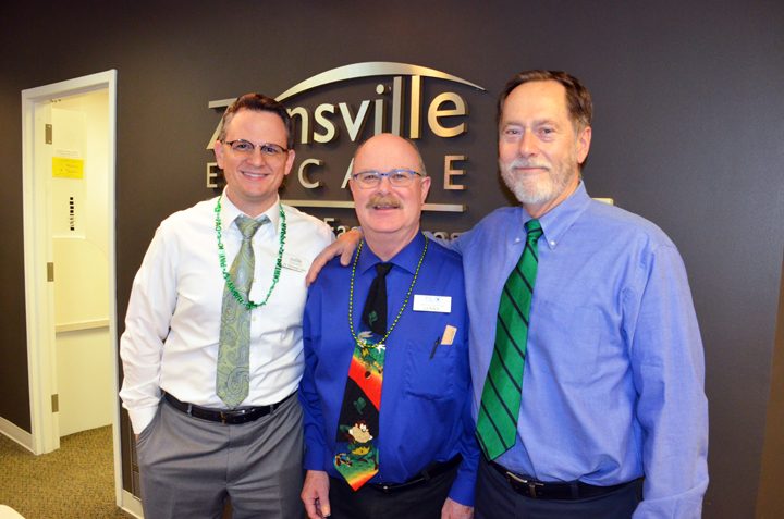 Eastin (center) stands with Zionsville Eyecare co-owners Dr. Nicholas Garn (left) and Dr. James Haines (right). “Lenny has been a good role model for the rest of the staff, and he will be missed,” Haines said. (Photo by Sara Baldwin)