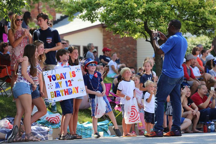 CBS 4 anchor Frank Mickens takes a photo during the parade. (Photo by Ann Marie Shambaugh)