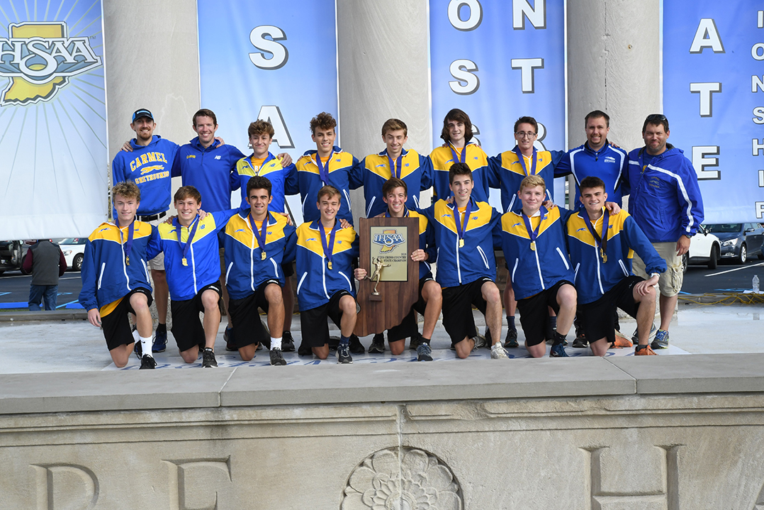 Carmel High School boys cross country team celebrates second consecutive state title