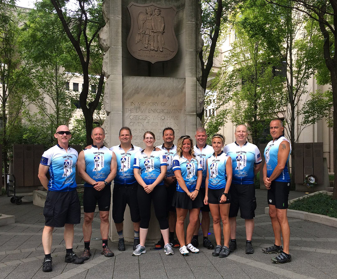 AA COM 0528 cops cycling for survivors 2019