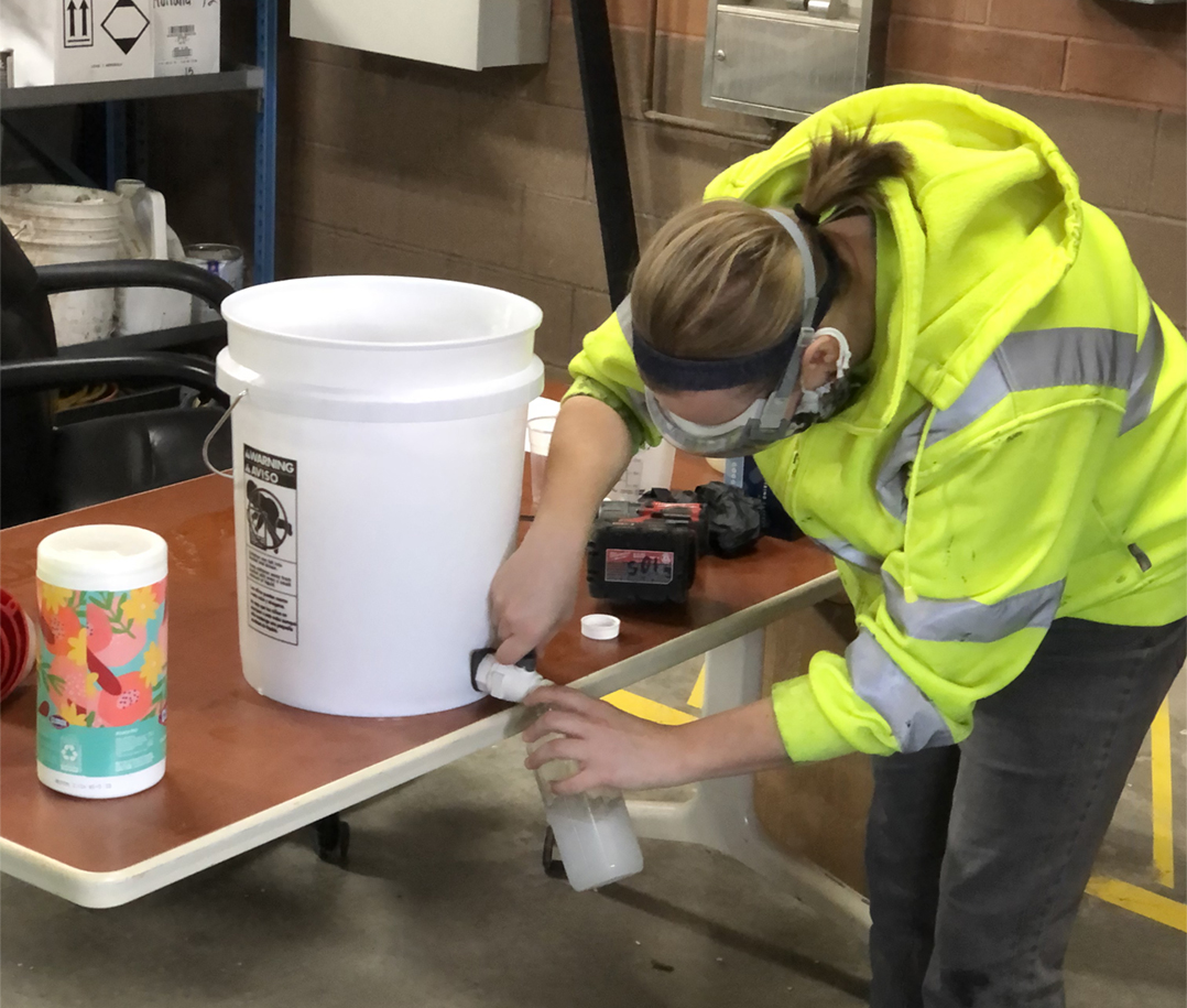 Carmel Street Dept. employee Talia Ariens fills a bottle of hand sanitizer. (Submitted photo)
